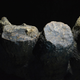 Charcoal sits in a carved-out stalagmite.